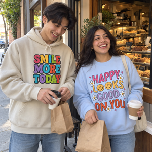 Friends wearing different Smile hoodies and crewnecks in an everyday moment.